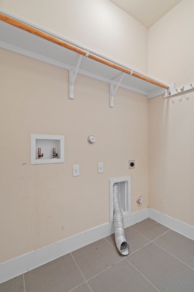 11229 Avery Station Loop, Unit 36 Austin, TX 78717 - Photo 29 of 37 Laundry area with gas dryer hookup, hookup for a washing machine, hookup for an electric dryer, and tile patterned flooring