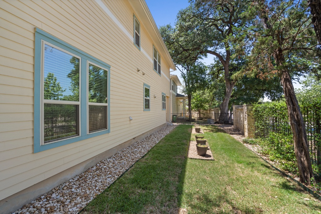 11229 Avery Station Loop, Unit 36 Austin, TX 78717 - Photo 33 of 37 Fenced backyard with a patio area