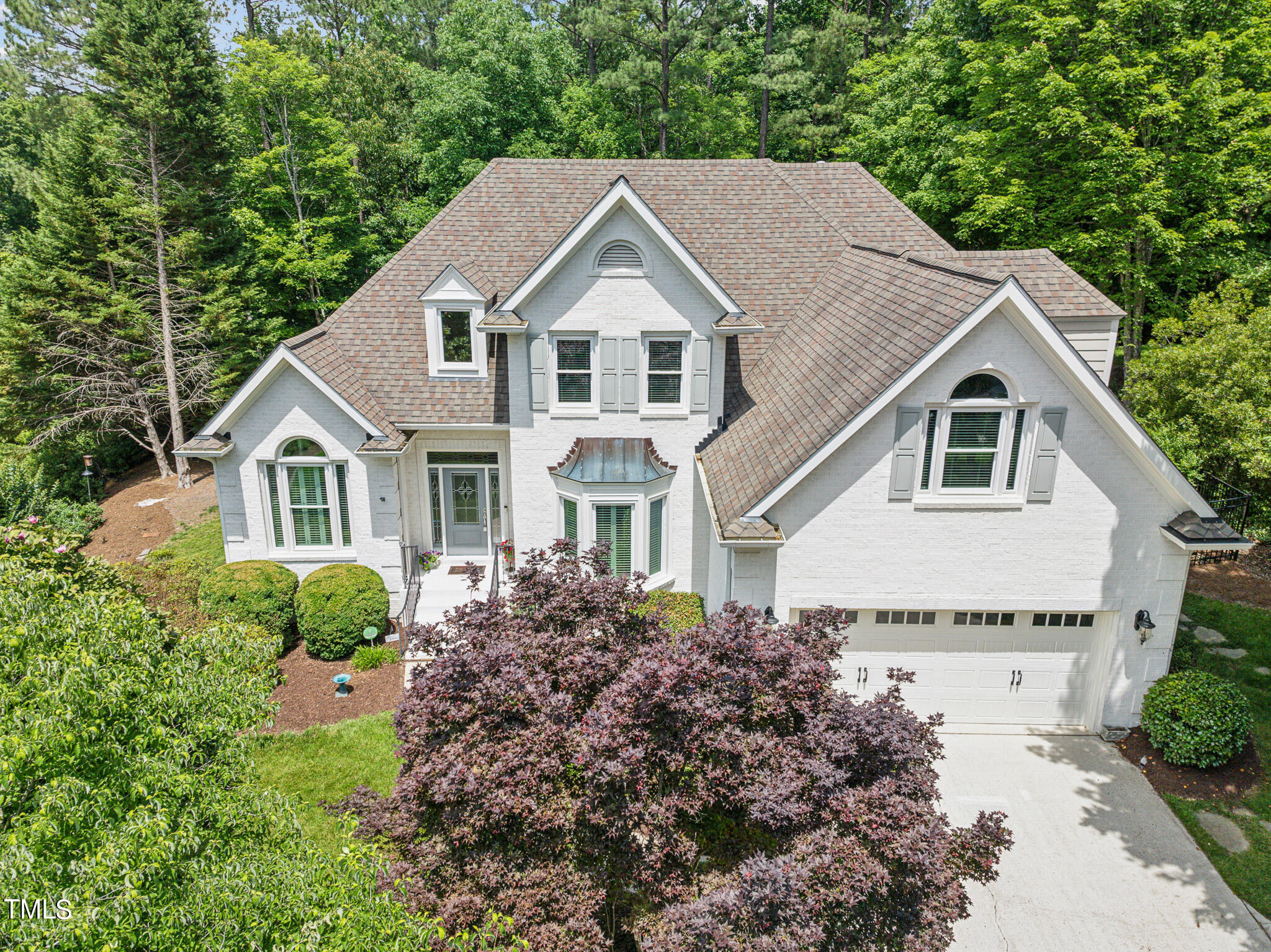 2508 Barton Ridge Court Raleigh, NC 27613 - Photo 1 of 41 a view of house with garden and tall tree