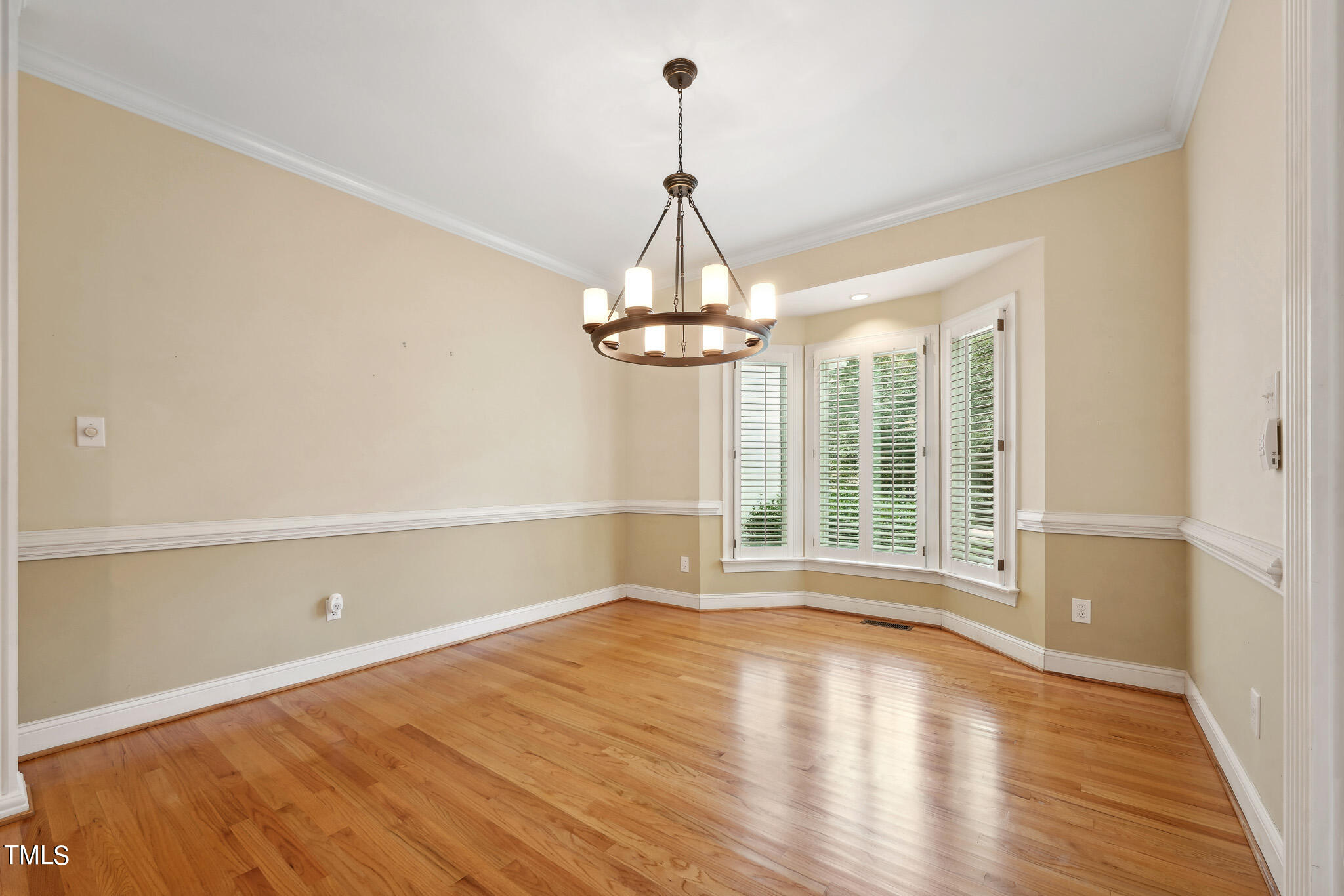 2508 Barton Ridge Court Raleigh, NC 27613 - Photo 18 of 41 a view of an empty room with wooden floor and a window
