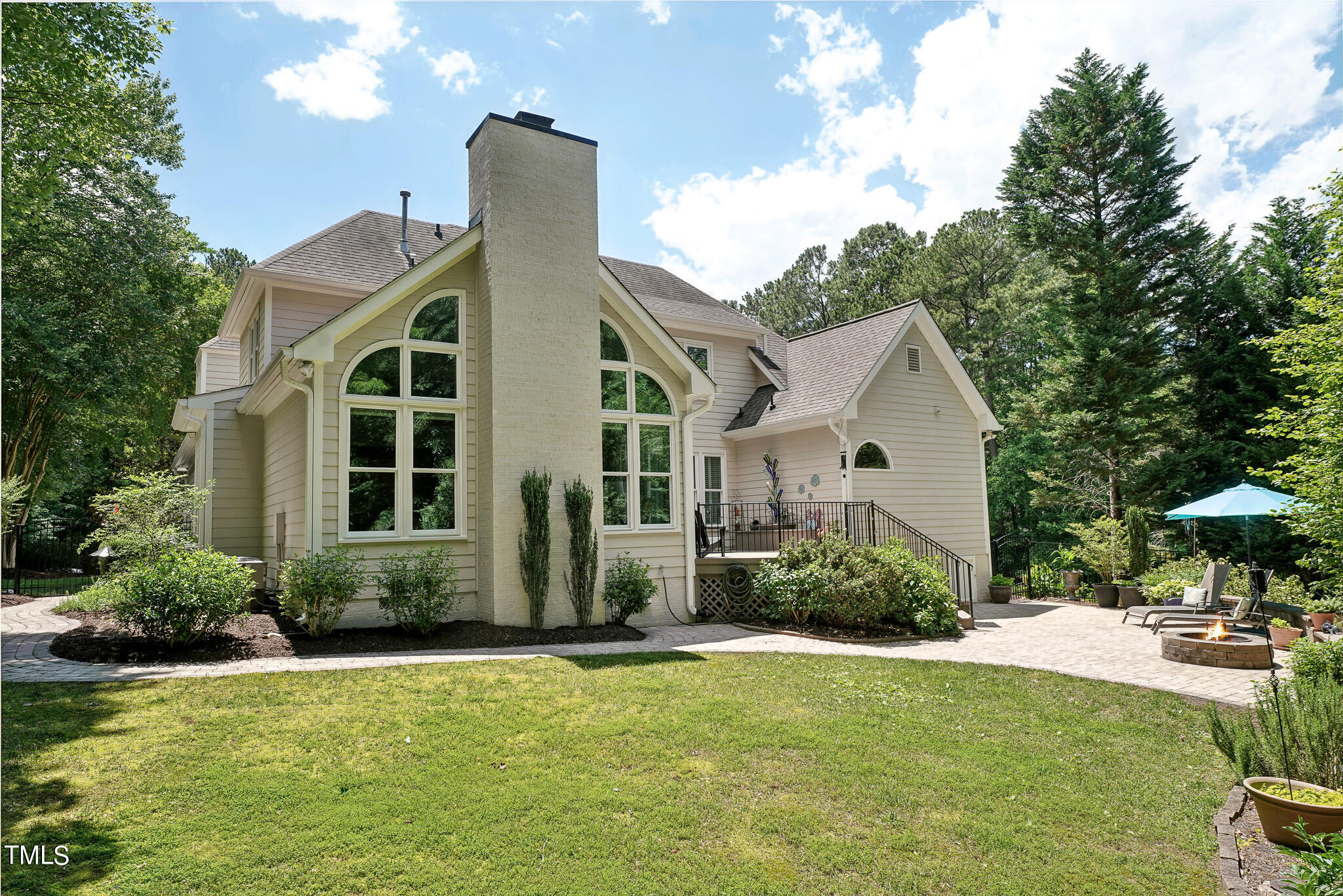 2508 Barton Ridge Court Raleigh, NC 27613 - Photo 33 of 41 a view of a white house with a yard and potted plants