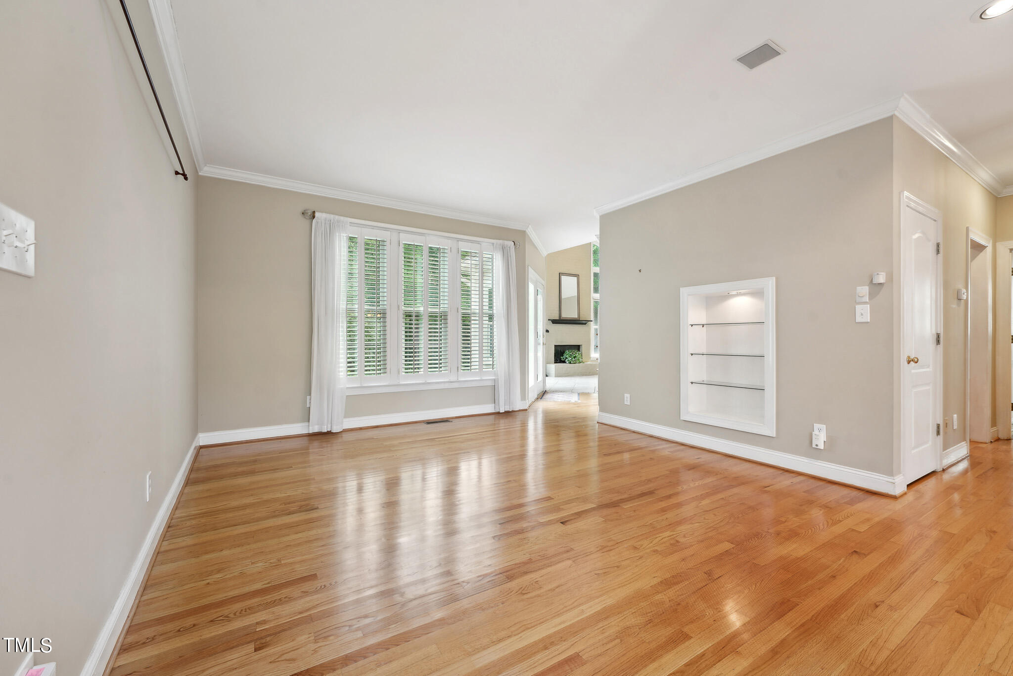 2508 Barton Ridge Court Raleigh, NC 27613 - Photo 5 of 41 a view of an empty room with wooden floor and windows