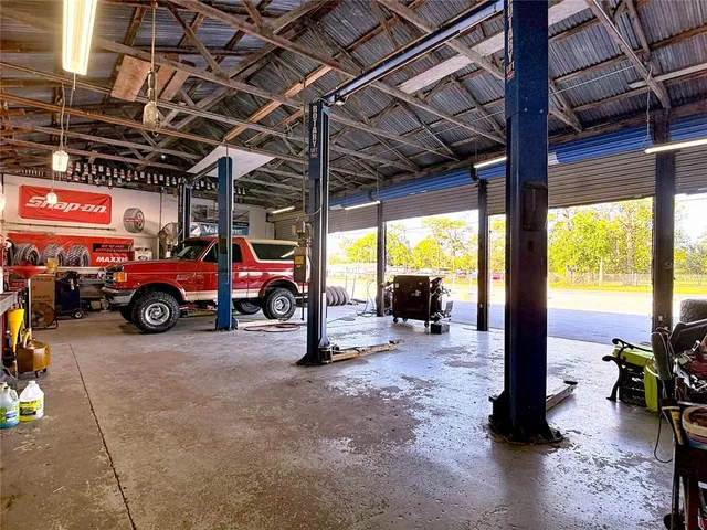 a view of a garage with a car parked