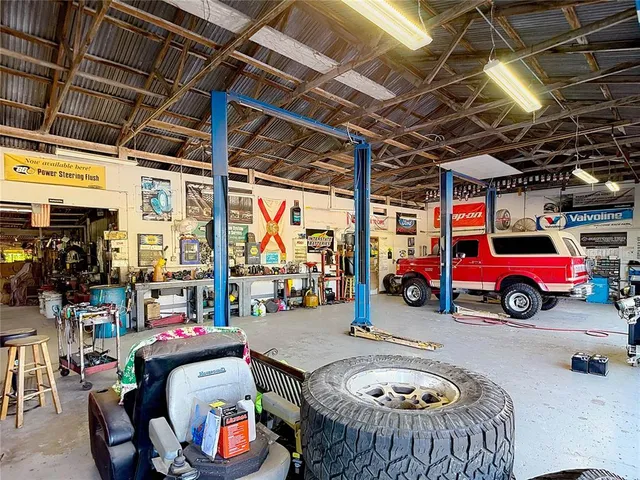 a view of parking garage with cars parked