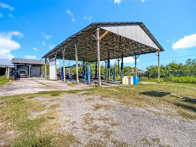 a view of a house with a yard patio and entertaining space