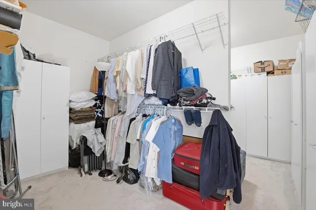 a kitchen with stainless steel appliances granite countertop a sink and a microwave