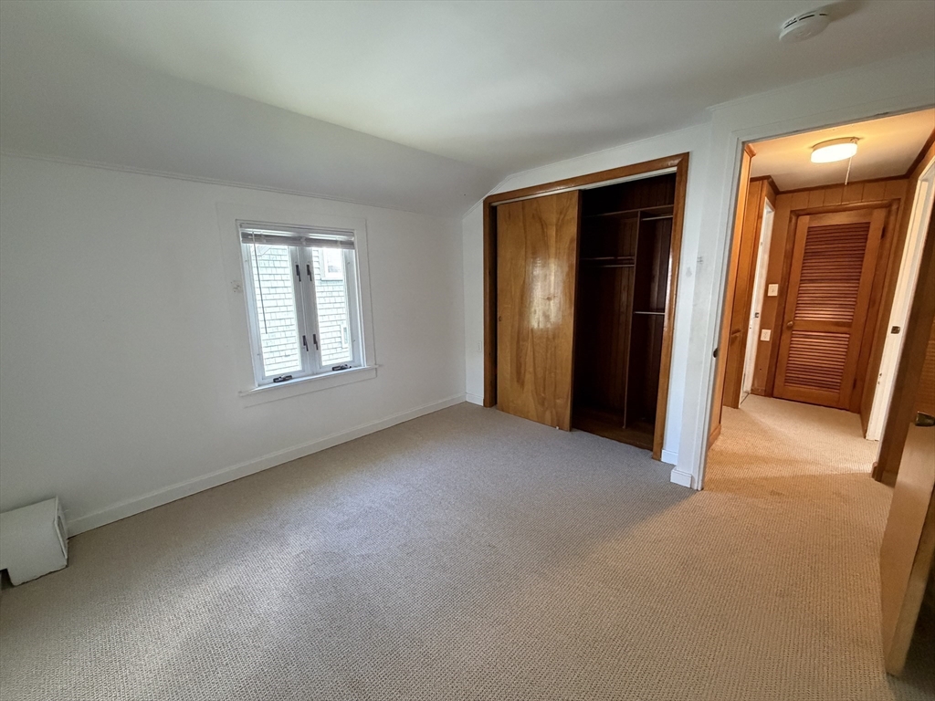 175 Spring Street, Unit 1 Hull, MA 02045 - Photo 11 of 15 a view of empty room with front door