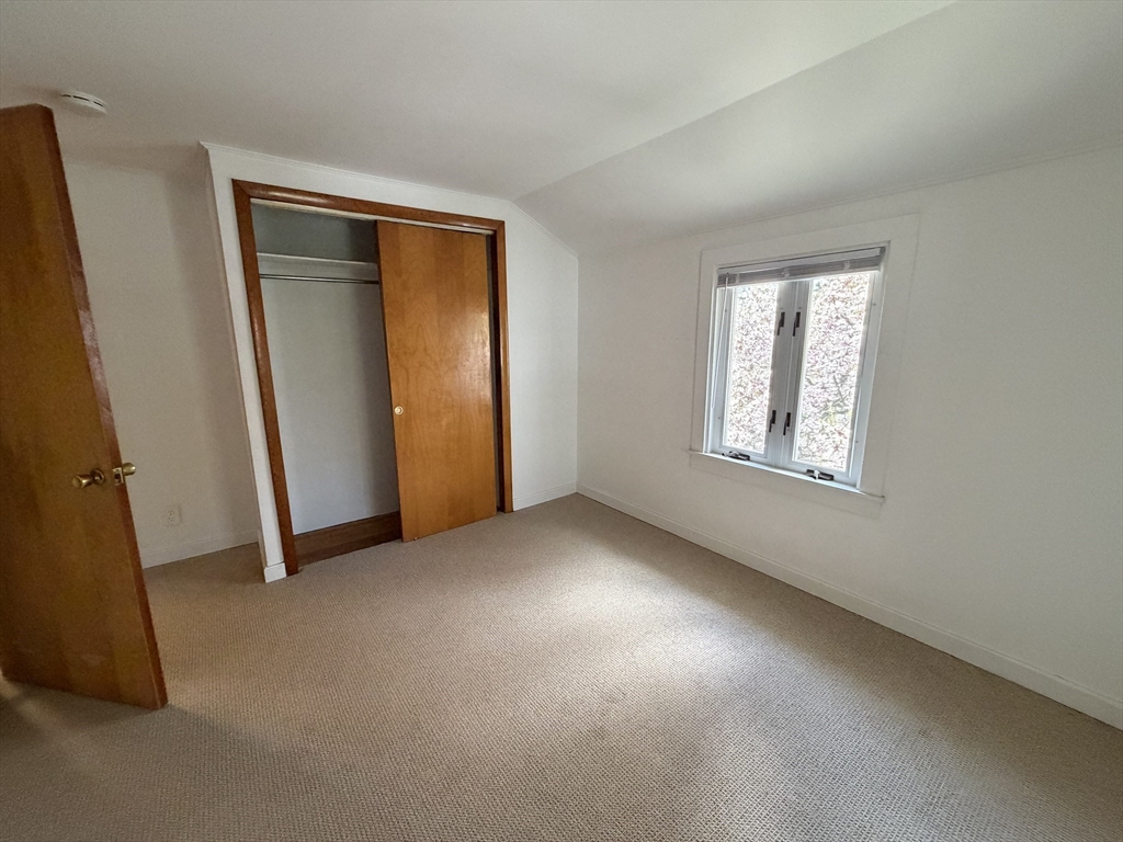 175 Spring Street, Unit 1 Hull, MA 02045 - Photo 10 of 15 an empty room with windows
