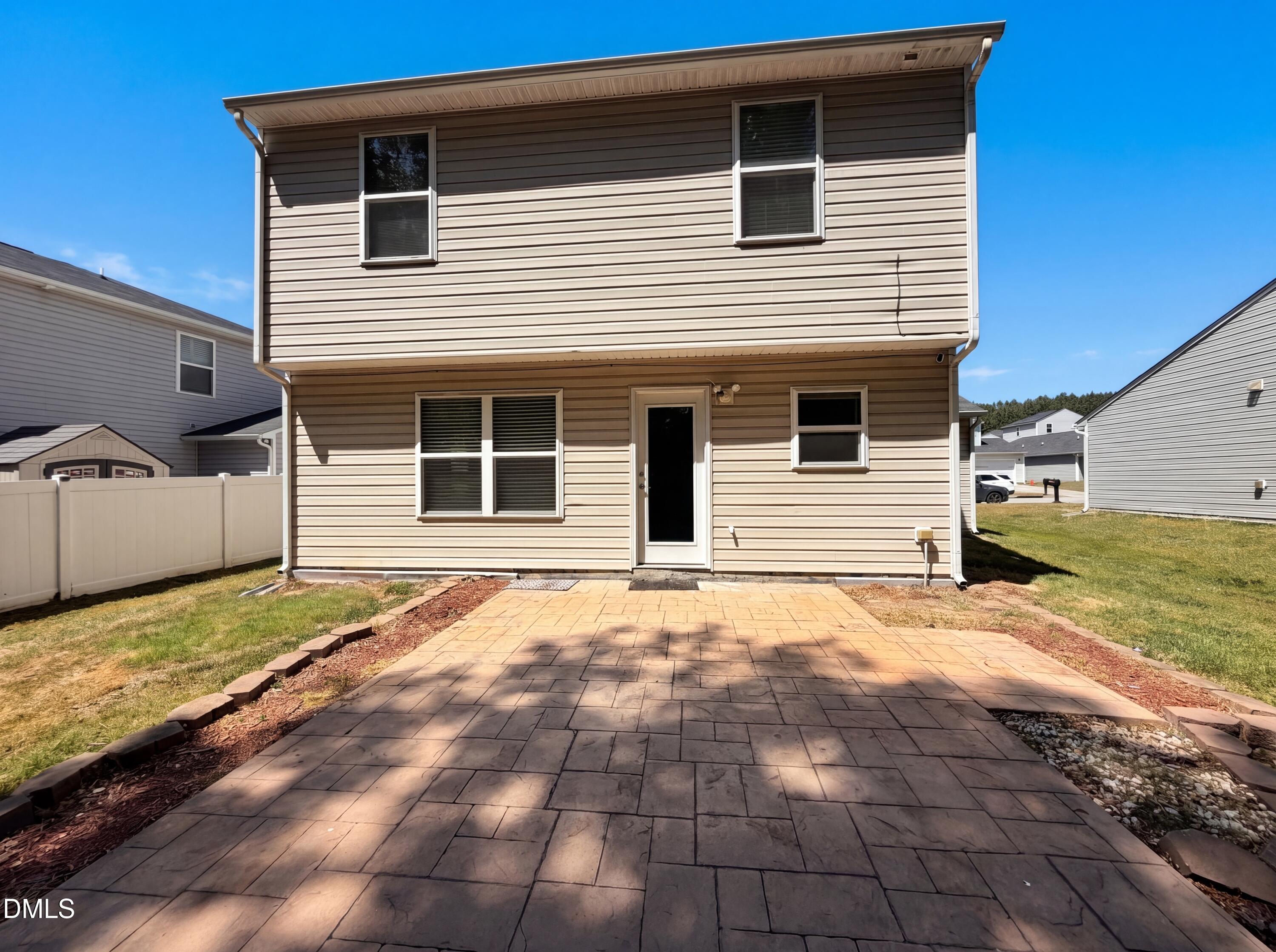 4716 Queen Pierrette Street Raleigh, NC 27610 - Photo 5 of 15 a front view of a house with a yard