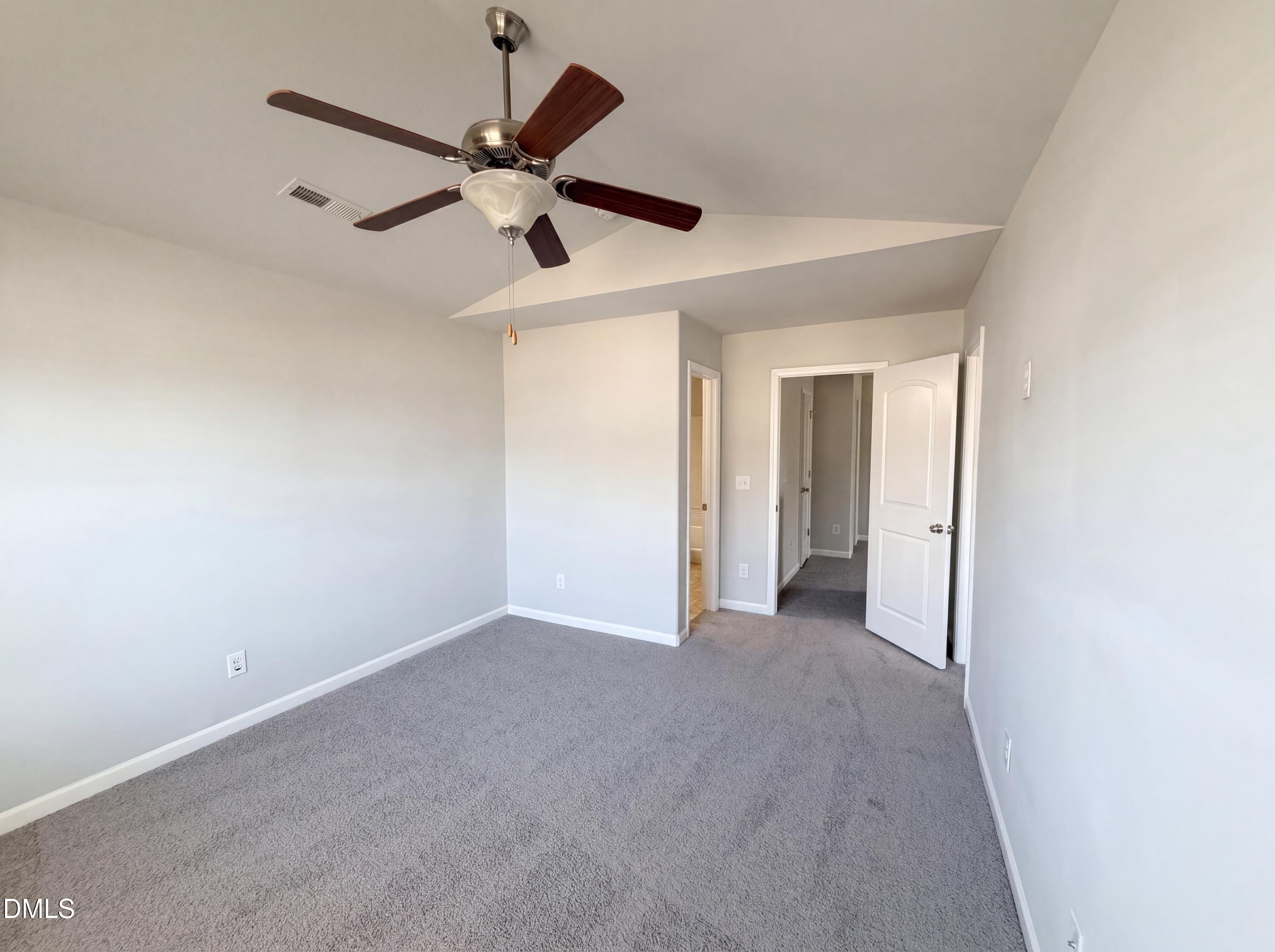 4716 Queen Pierrette Street Raleigh, NC 27610 - Photo 7 of 15 a view of an empty room