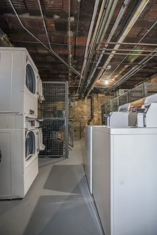 a view of storage and utility room with washer and dryer