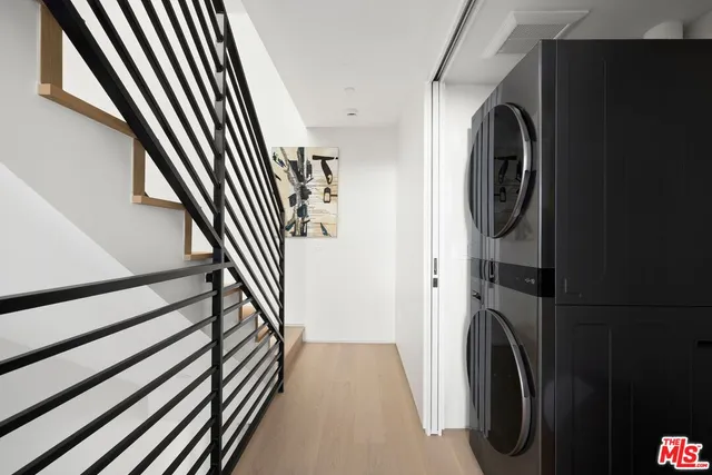 a view of a hallway with washer and dryer