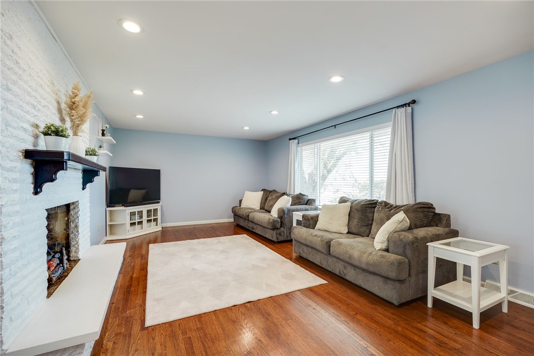 6950 Red Lion 5 Points Road Springboro, OH 45066 - Photo 11 of 78 This inviting living room features gleaming hardwood floors and a cozy fireplace.
