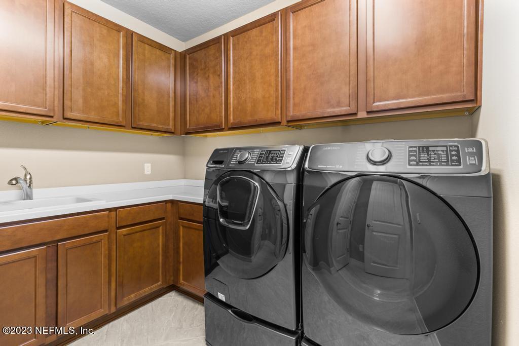 280 Winding Path Drive Ponte Vedra, FL 32081 - Photo 23 of 94 Laundry Room with a Sink & Cabinetry