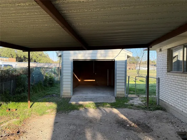 a view of a porch with a table and a chairs