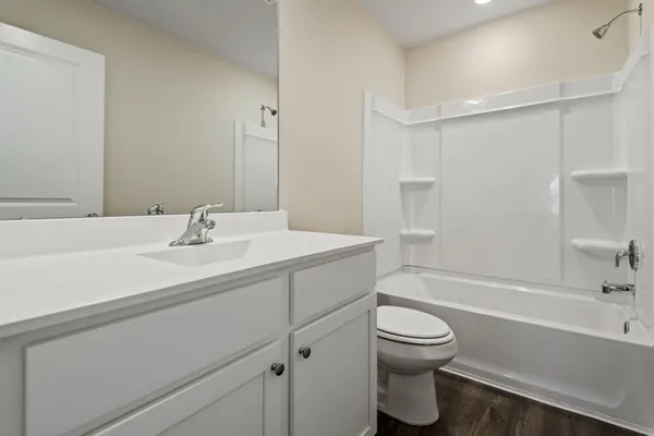 a bathroom with a sink a toilet and a bathtub