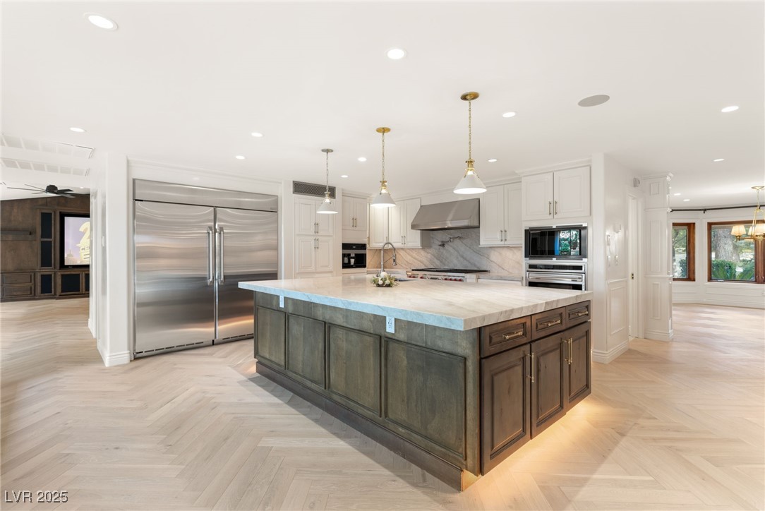 105 Quail Run Road Henderson, NV 89014 - Photo 14 of 88 Kitchen featuring built in appliances, white cabin