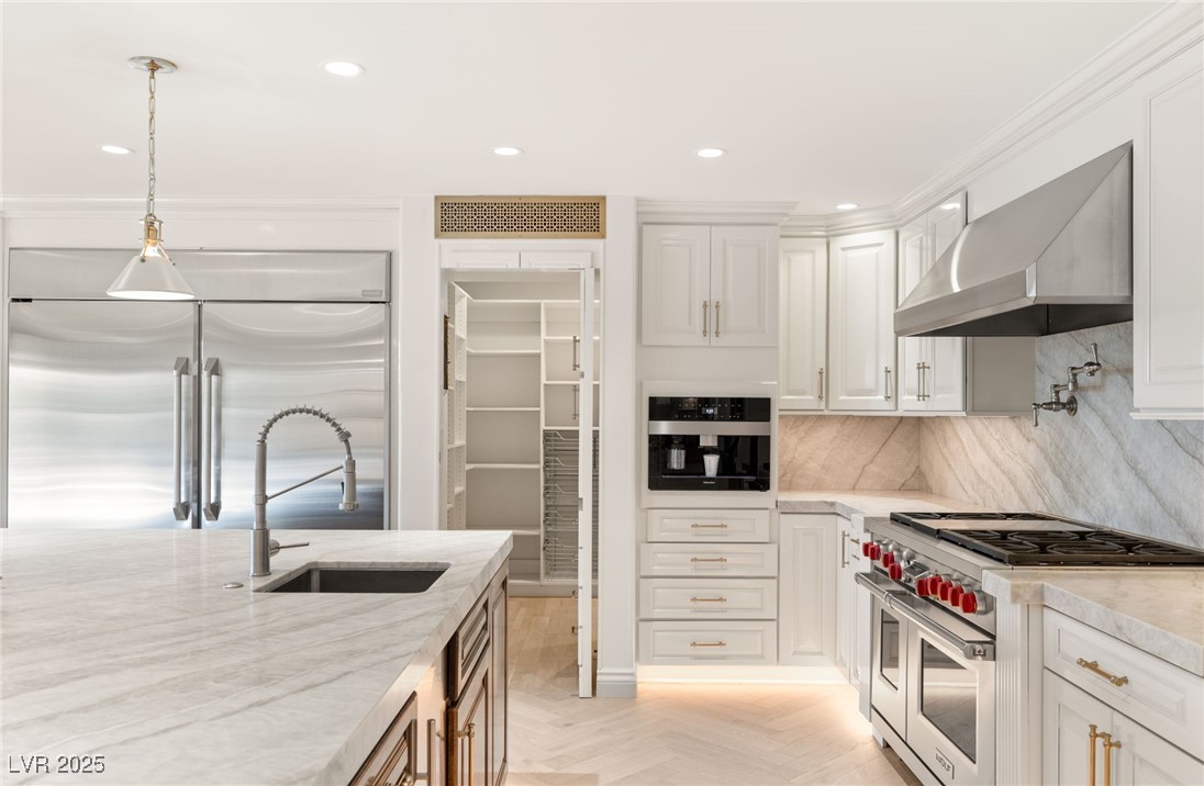 105 Quail Run Road Henderson, NV 89014 - Photo 16 of 88 Kitchen with high end appliances, wall chimney ran