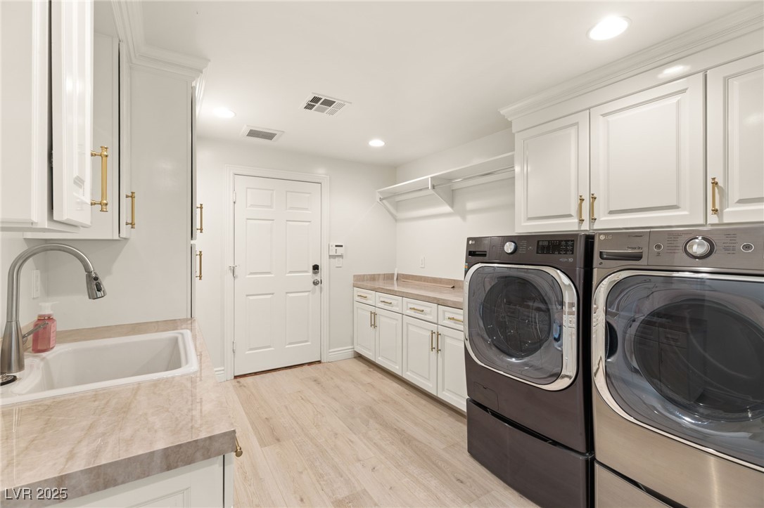 105 Quail Run Road Henderson, NV 89014 - Photo 19 of 88 Laundry room with washing machine and clothes drye