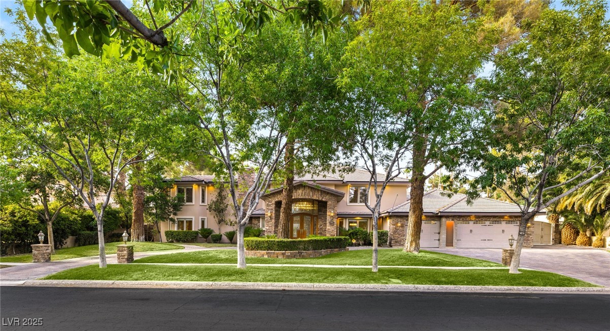105 Quail Run Road Henderson, NV 89014 - Photo 2 of 88 View of front of home featuring concrete driveway,