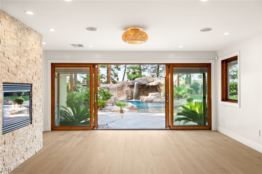 105 Quail Run Road Henderson, NV 89014 - Photo 21 of 88 Doorway to outside featuring wood finished floors