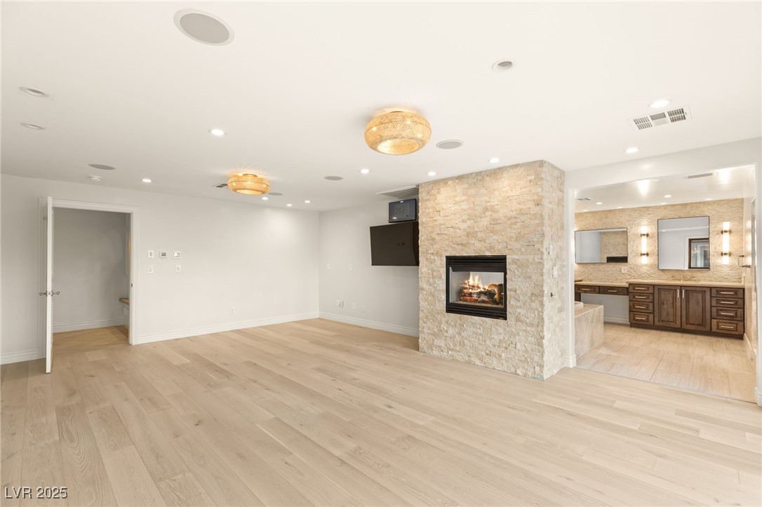 105 Quail Run Road Henderson, NV 89014 - Photo 22 of 88 Unfurnished living room with light wood finished f