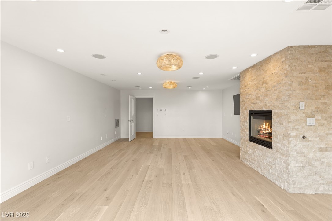 105 Quail Run Road Henderson, NV 89014 - Photo 23 of 88 Unfurnished living room with light wood-style floo