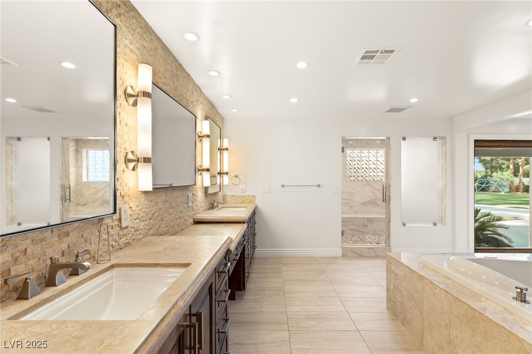 105 Quail Run Road Henderson, NV 89014 - Photo 25 of 88 Bathroom featuring double vanity, tasteful backspl