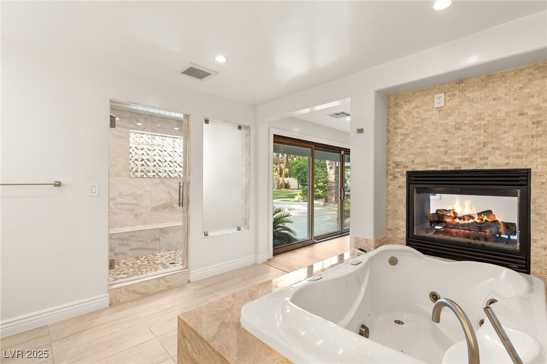 105 Quail Run Road Henderson, NV 89014 - Photo 26 of 88 Full bathroom with a whirlpool tub, a shower stall