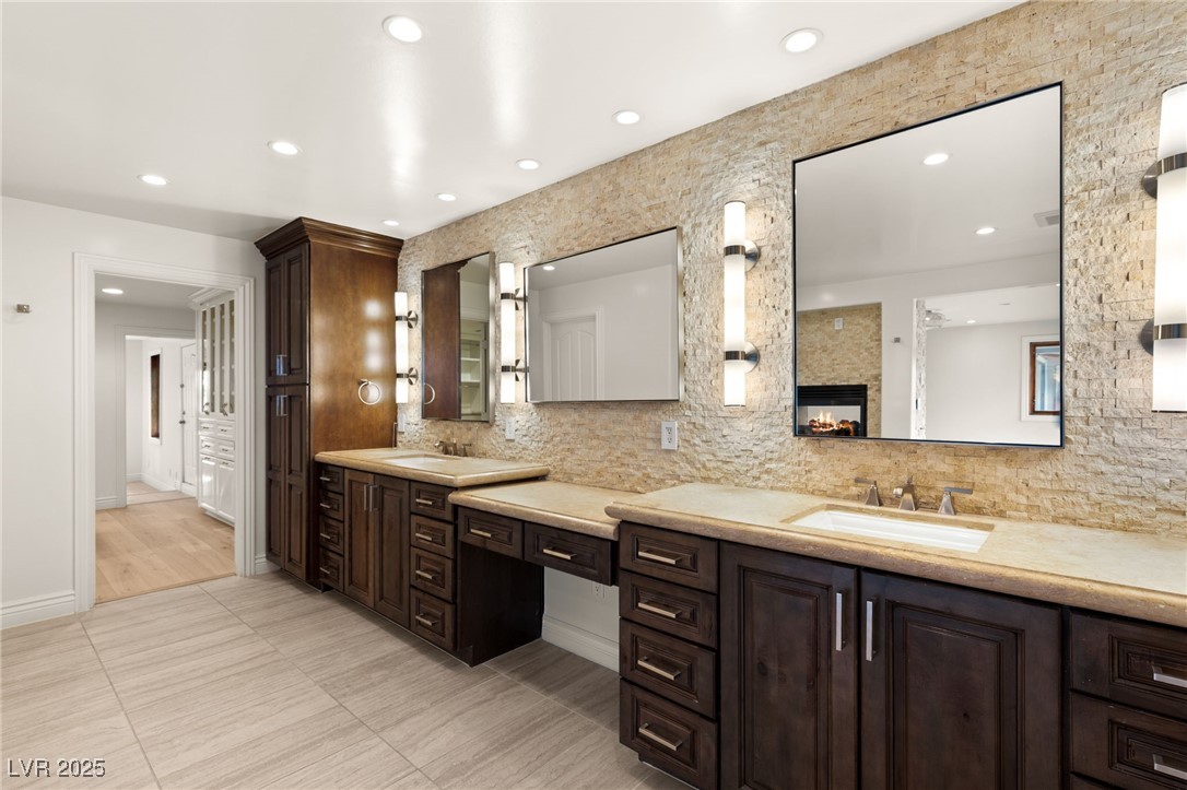 105 Quail Run Road Henderson, NV 89014 - Photo 27 of 88 Bathroom with vanity, tasteful backsplash, a multi