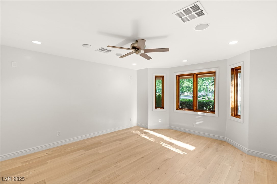 105 Quail Run Road Henderson, NV 89014 - Photo 31 of 88 Spare room with ceiling fan, light wood-style floo