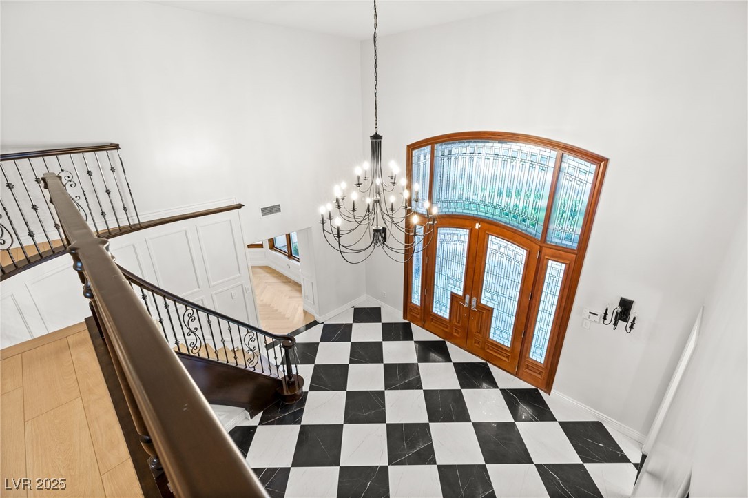 105 Quail Run Road Henderson, NV 89014 - Photo 39 of 88 Tiled foyer entrance featuring a towering ceiling,