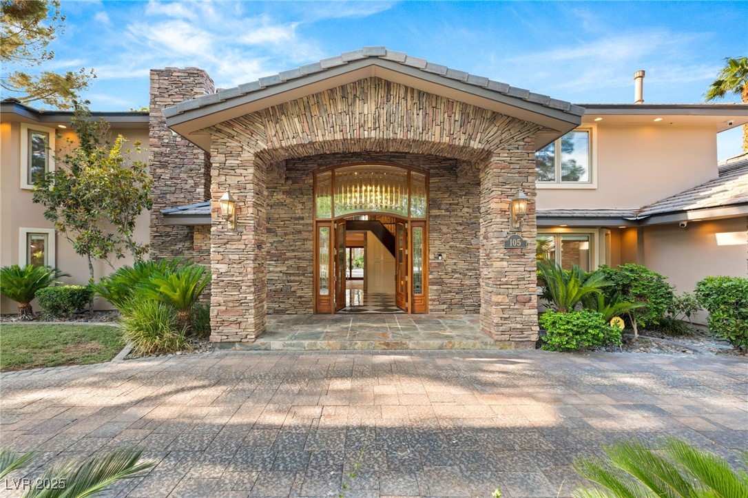 105 Quail Run Road Henderson, NV 89014 - Photo 4 of 88 Property entrance featuring stone siding and stucc