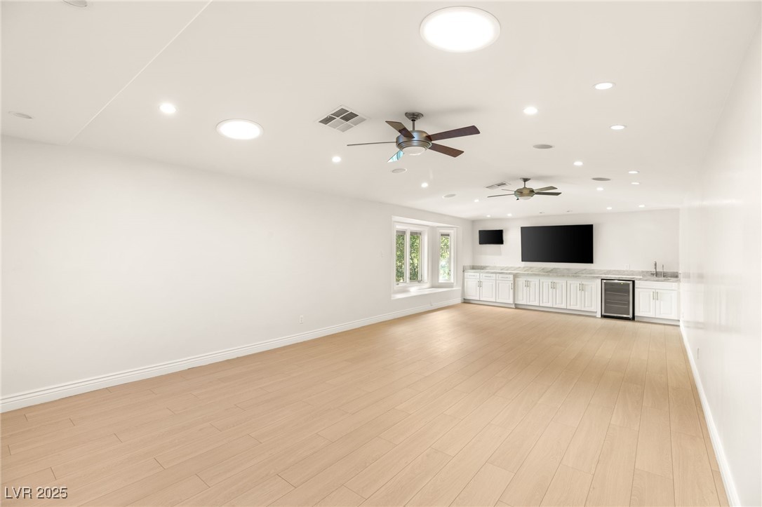 105 Quail Run Road Henderson, NV 89014 - Photo 41 of 88 Unfurnished living room featuring wine cooler, rec