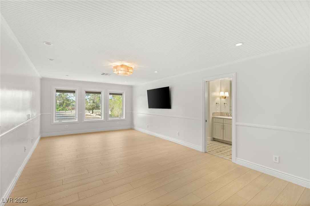 105 Quail Run Road Henderson, NV 89014 - Photo 49 of 88 Unfurnished living room featuring light wood finis