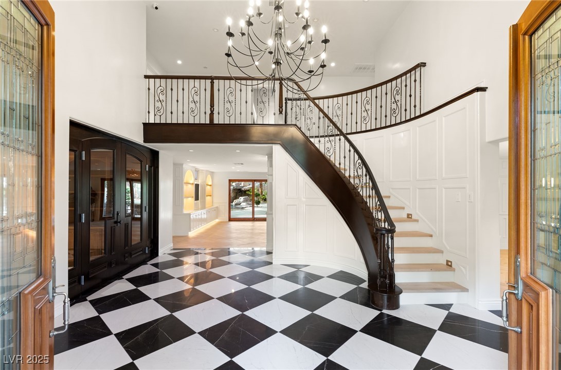 105 Quail Run Road Henderson, NV 89014 - Photo 5 of 88 Entrance foyer with a towering ceiling, stairs, an