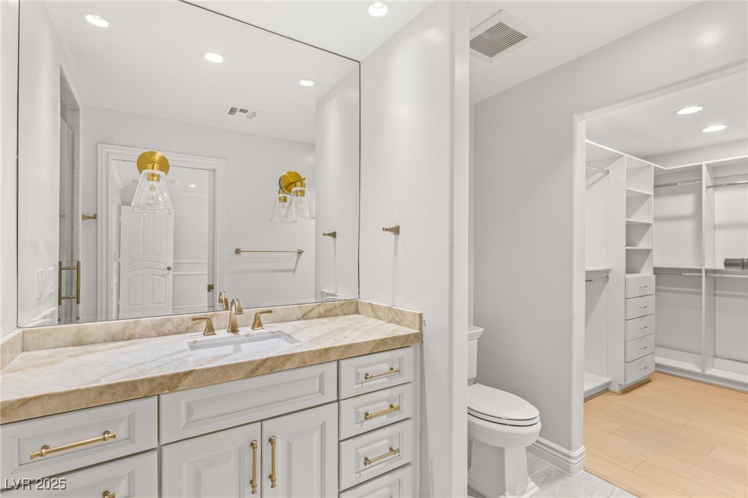 105 Quail Run Road Henderson, NV 89014 - Photo 53 of 88 Bathroom with vanity, recessed lighting, wood fini