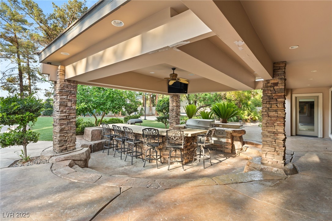 105 Quail Run Road Henderson, NV 89014 - Photo 56 of 88 View of patio with exterior bar, an outdoor kitche