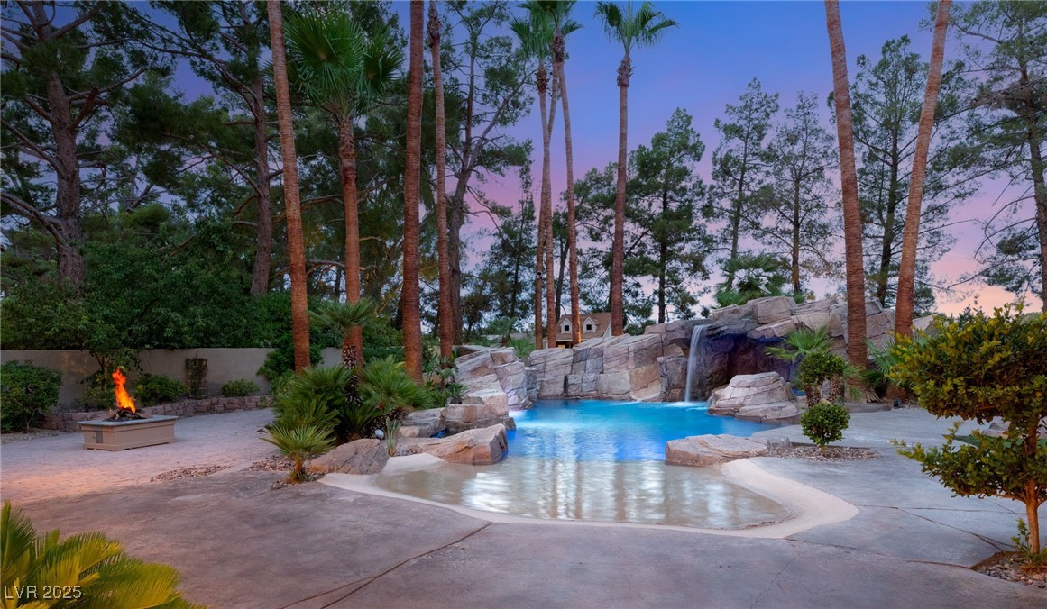 105 Quail Run Road Henderson, NV 89014 - Photo 71 of 88 View of swimming pool featuring a fire pit and a p