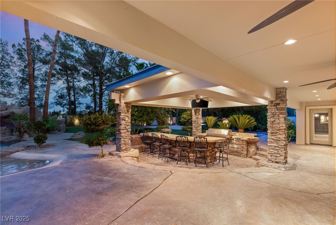 105 Quail Run Road Henderson, NV 89014 - Photo 72 of 88 View of patio featuring an outdoor bar, exterior k