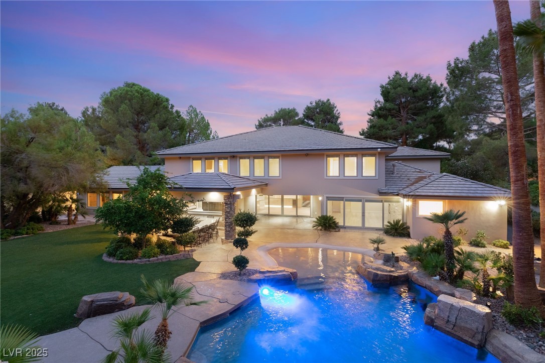 105 Quail Run Road Henderson, NV 89014 - Photo 75 of 88 Back of property at dusk featuring stucco siding,