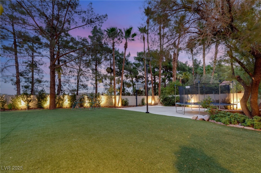 105 Quail Run Road Henderson, NV 89014 - Photo 76 of 88 Fenced backyard with a trampoline