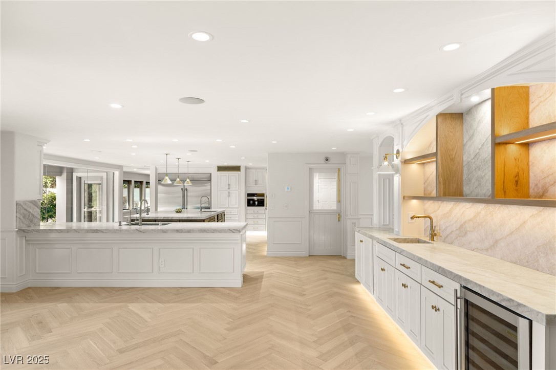 105 Quail Run Road Henderson, NV 89014 - Photo 10 of 88 Kitchen with wine cooler, a peninsula, recessed li