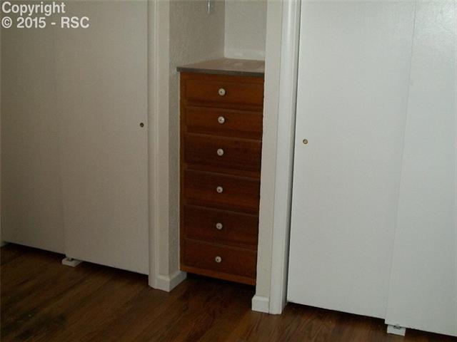 612 Sunset Road Colorado Springs, CO 80909 - Photo 7 of 27 Master Bedroom W/ Double Closets & Built In Drawers