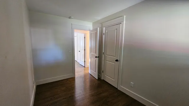 a view of a bathroom from a hallway