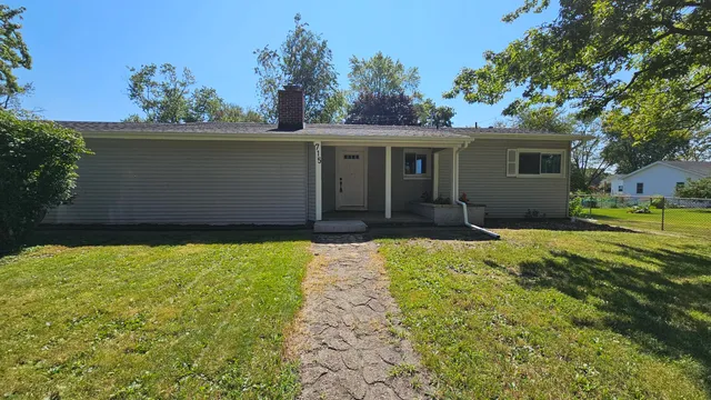 a house view with a garden space