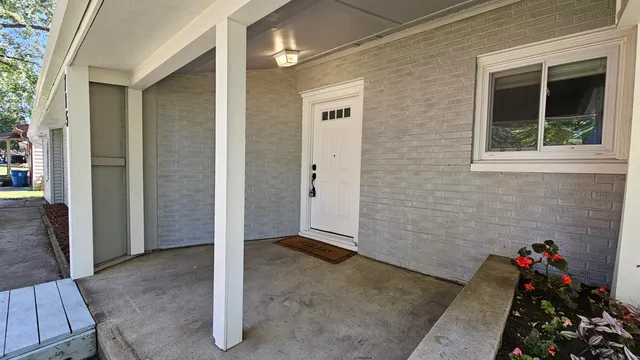 a large kitchen with a large counter top stainless steel appliances and cabinets
