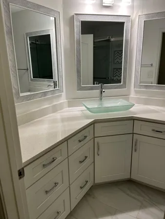 a bathroom with sink and mirror