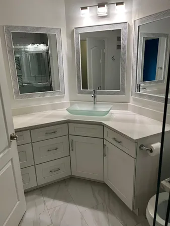 a bathroom with a sink and mirror