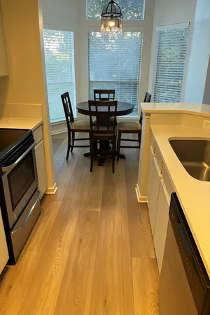 a kitchen with a sink appliances and cabinets